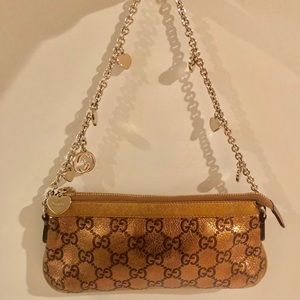 Gold heart chain clutch